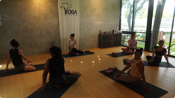 A candlelit recovery yoga class